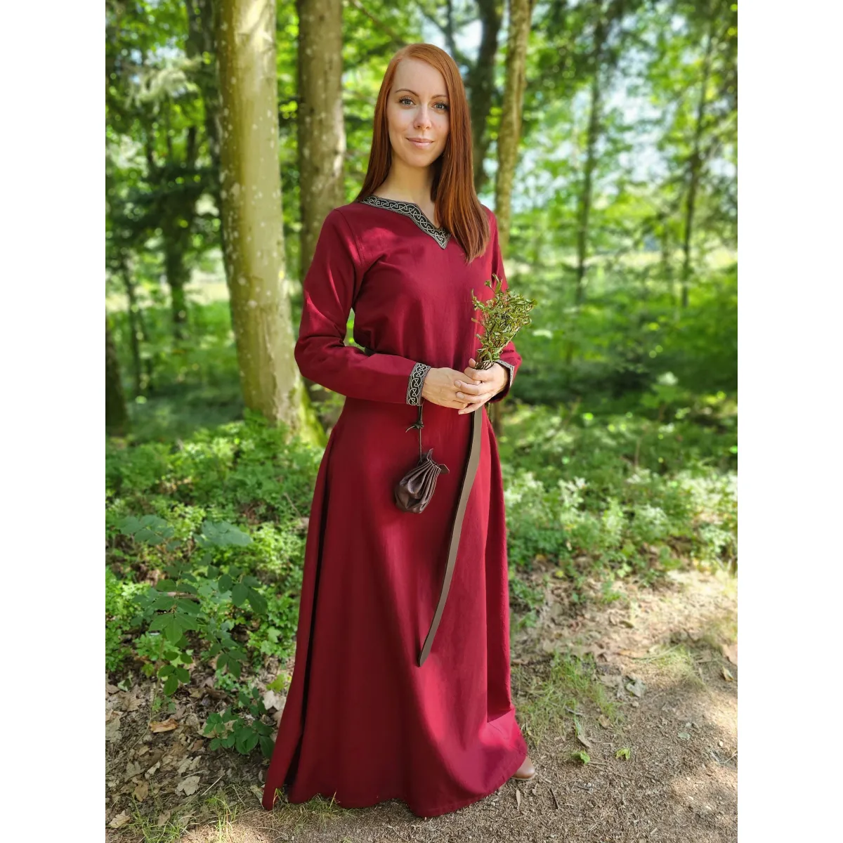 Woman in red long-sleeved dress with braid
